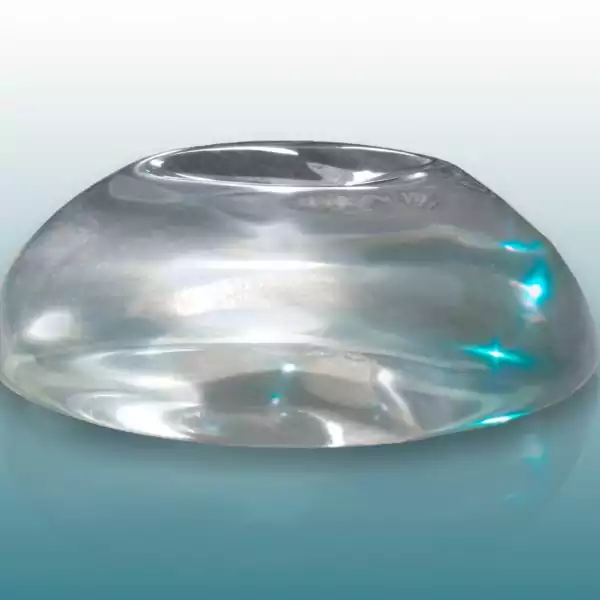 A clear glass bowl with blue background.