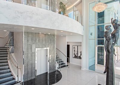 A marble staircase with a statue in the middle.