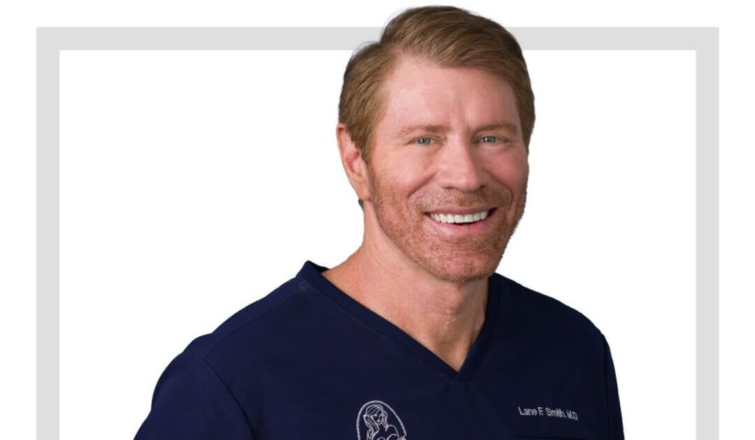 Man with short hair and a beard, wearing a navy blue shirt, smiling at the camera in Las Vegas.