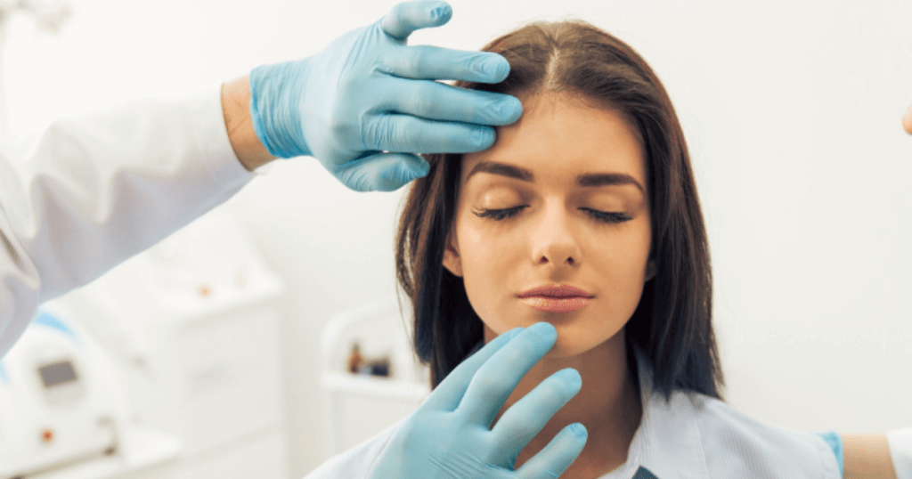 Patient receiving a personalized facial evaluation during a cosmetic consultation at Smith Plastic Surgery in Las Vegas