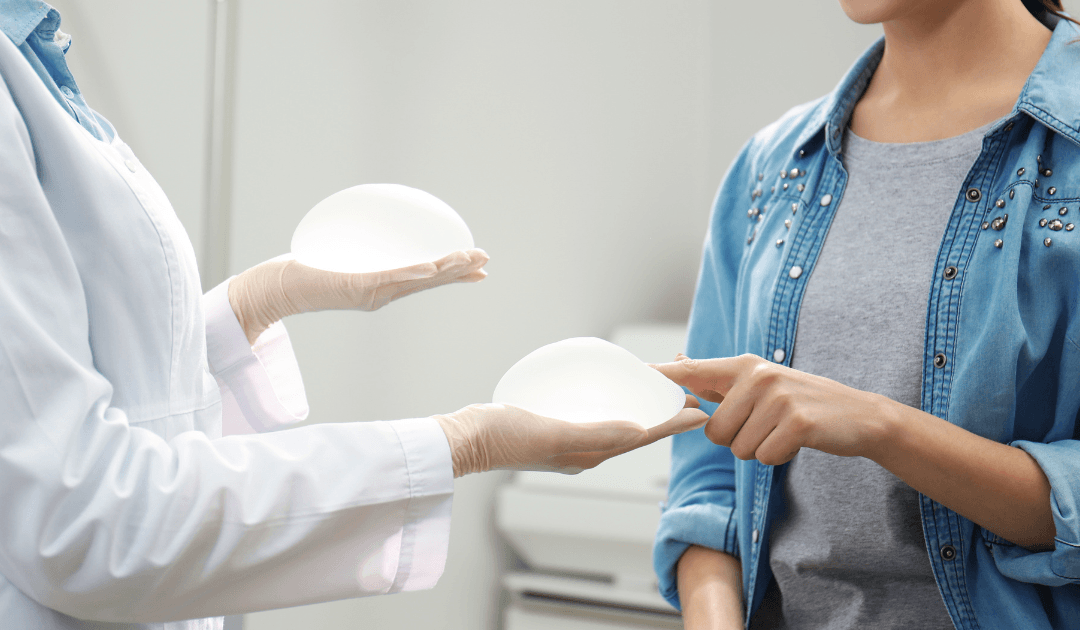 Breast implant consultation showing patient choosing implant size for breast augmentation and breast lift in Las Vegas