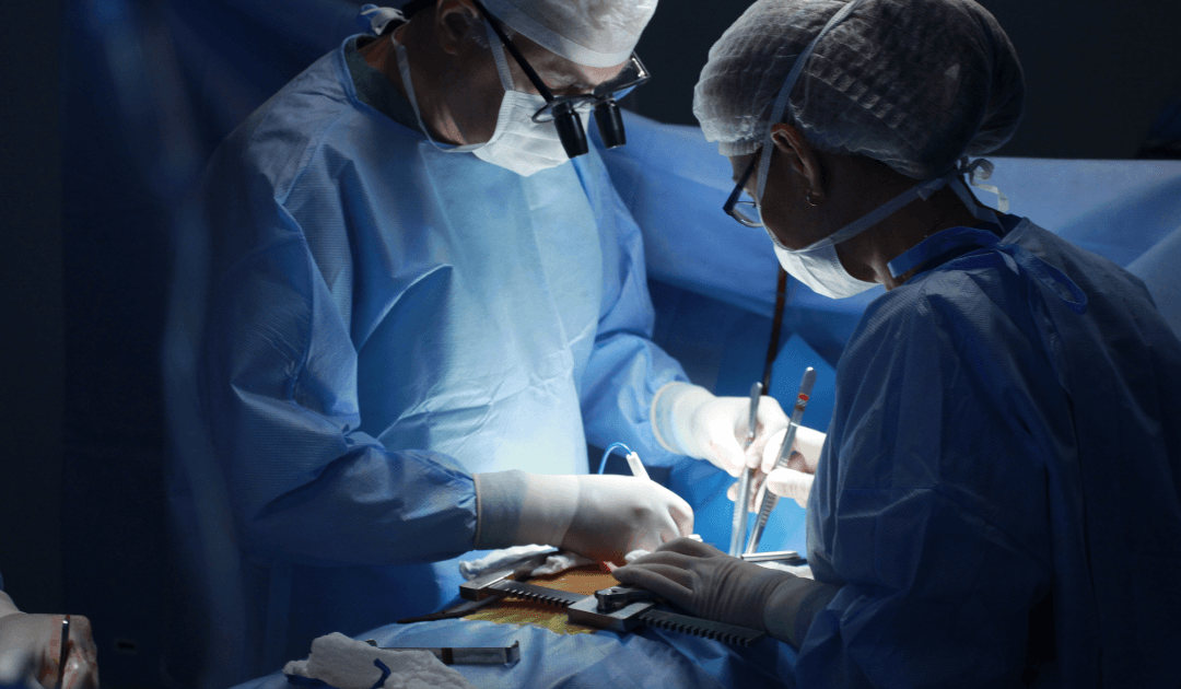 Plastic surgeons performing breast lift surgery in an operating room, illustrating surgical care and breast lift costs